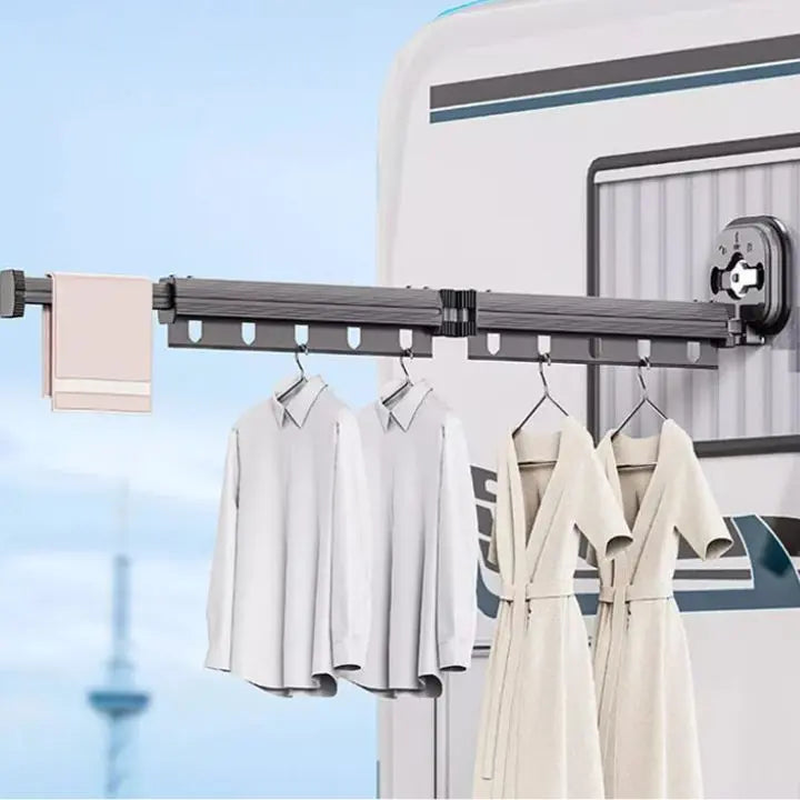 Wall-mounted foldable clothes drying rack with suction cups
